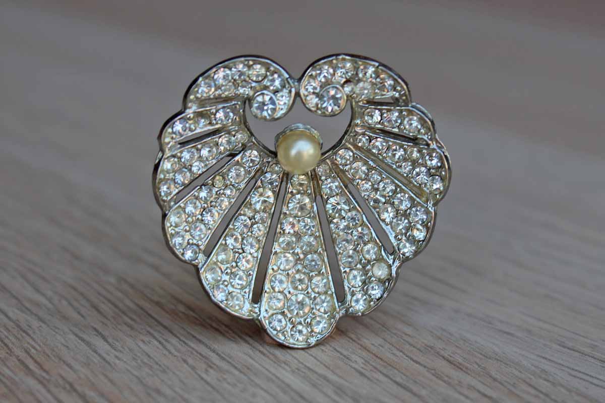 Clamshell Shaped Brooch with Pave Set Silver Rhinestones and Faux Pearl Accent