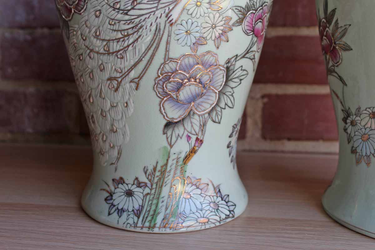 Baluster Shaped Moriaged Vases Depicting Lilac, Gold and White Peacocks and Flowers Over an Off White Background