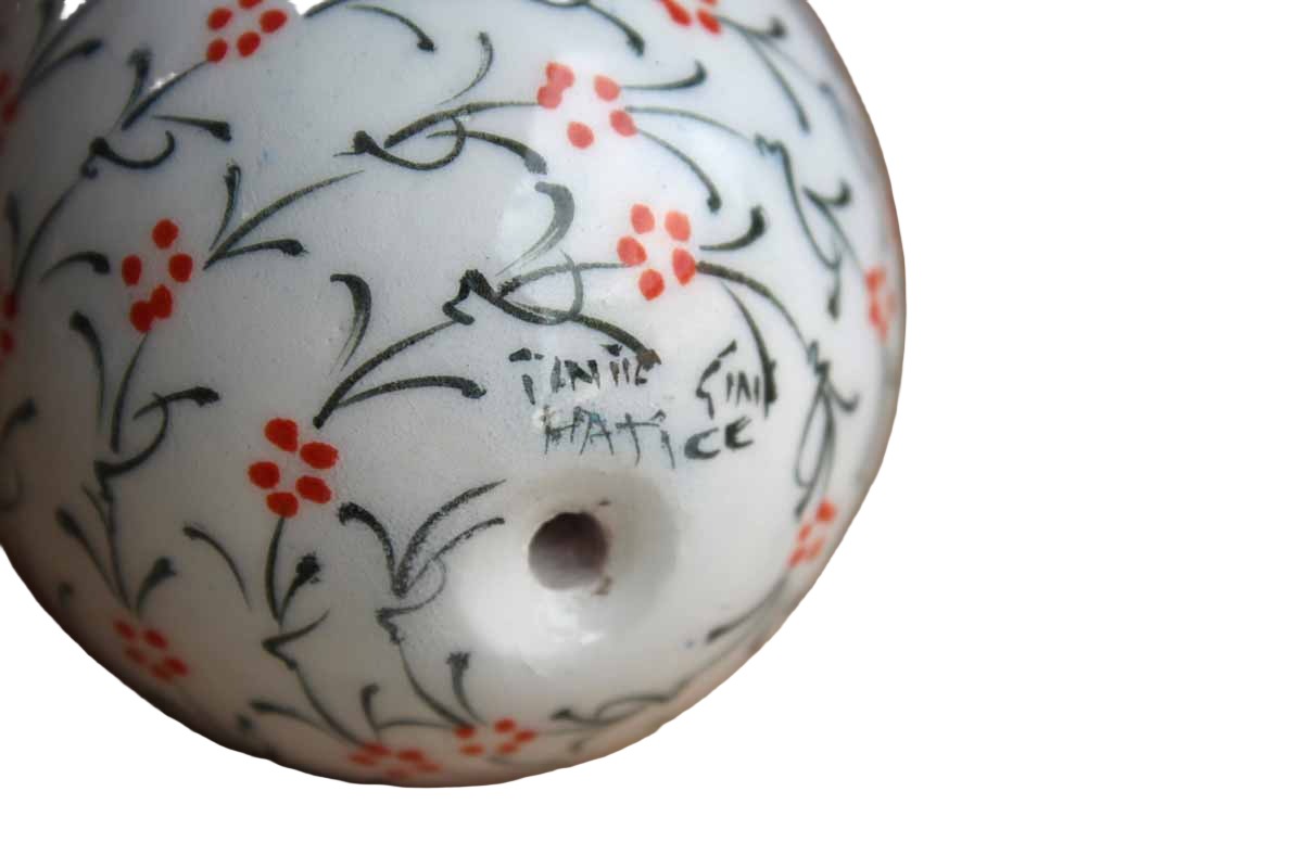 Hand-Painted Ceramic Egg with Repeating Red and Green Flower Pattern