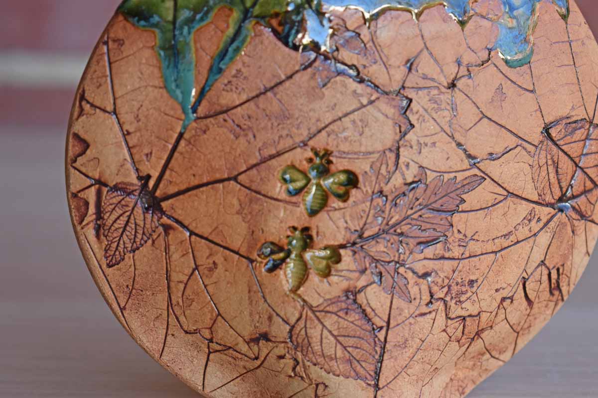 Small Pillow Vase with Incised Leaf and Bee Designs