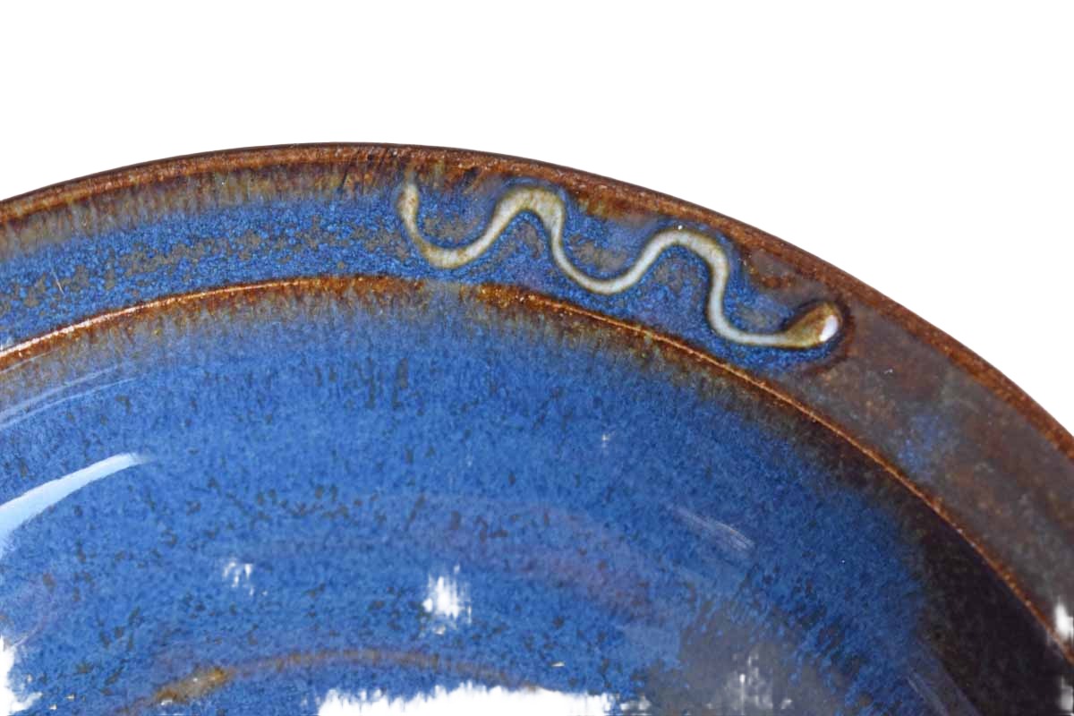 Shallow Ceramic Bowl with Bluish-Brown Glazes and Curvy Rim Designs