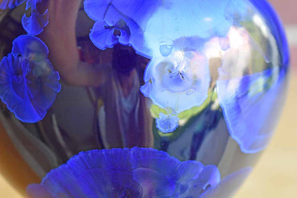 Rounded Dark Blue Ceramic Vase with Iridescent Flower Shapes