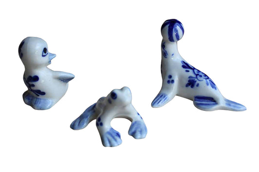 Blue and White Ceramic Figurines of a Frog, Seal, and Duck