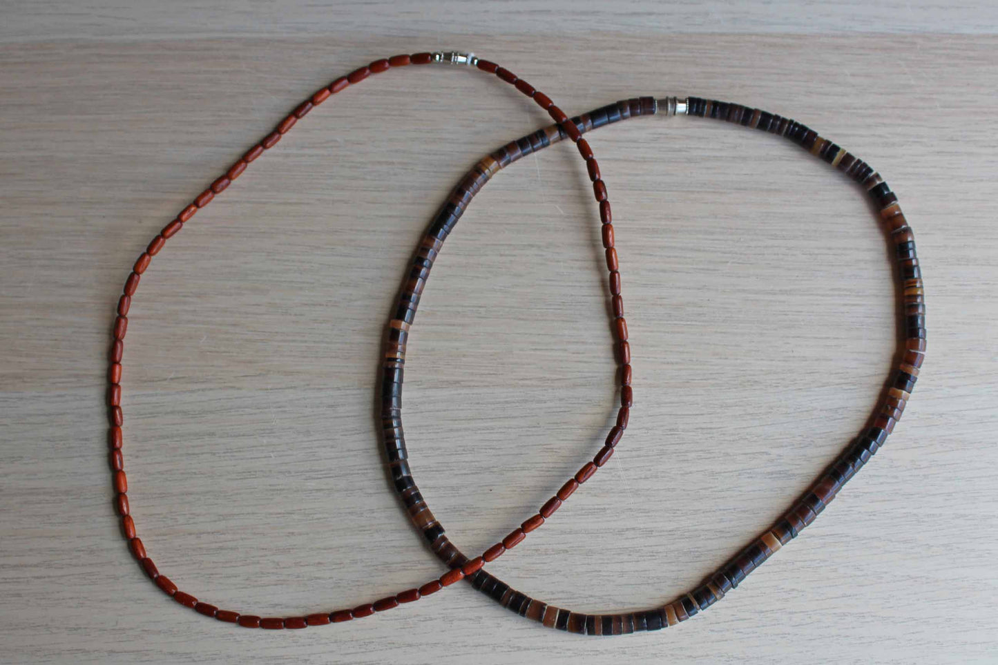 Pair of Polished Wood and Brown Stone Beaded Necklaces