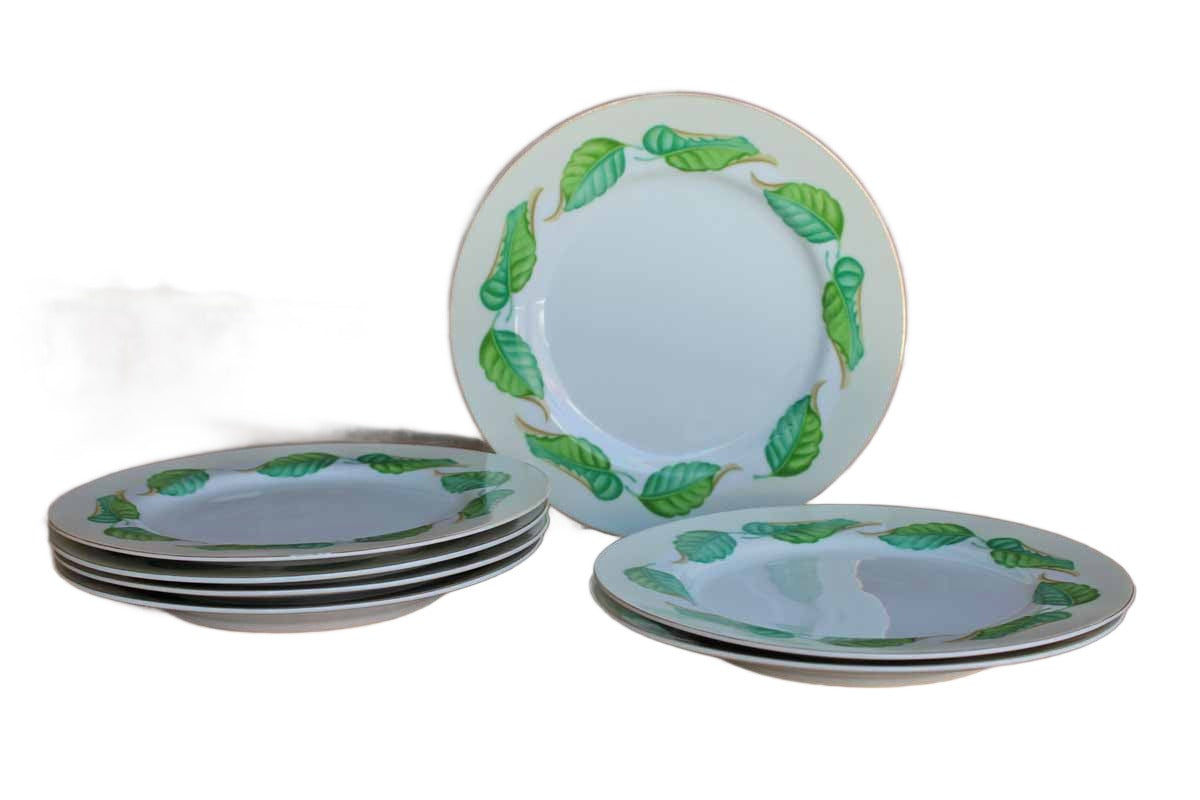 A set of seven dessert or salad plates with painted green and blue leaves set around gilded rims.  The plates measure 7 1/2" across and the bottoms are marked "Made in Occupied Japan,"  which indicates that these plates were produced between 1945 through April 25, 1952.  The condition of all plates is very good.