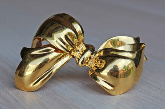 Monet (New York, USA) Large Shiny Gold Tone Bow Brooch