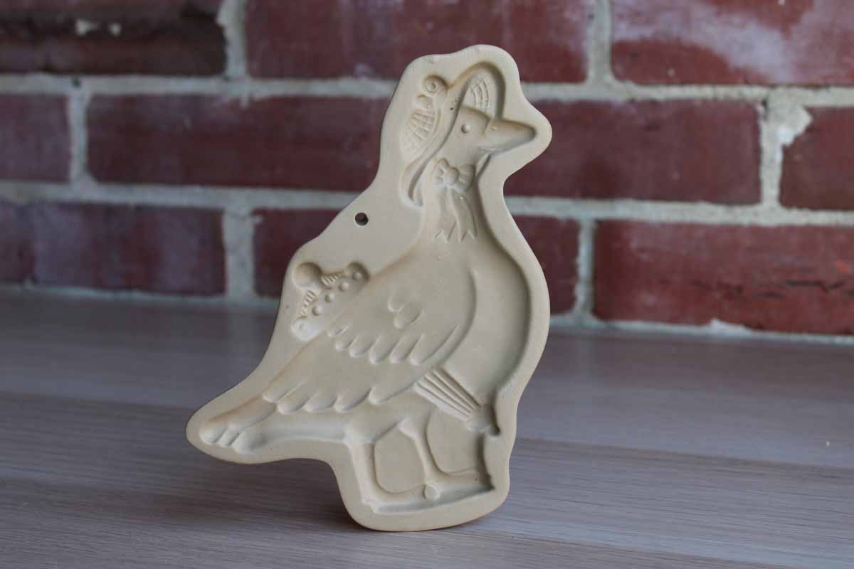 Brown Bag Cookie Art (New Hampshine, USA) 1992 Stoneware Cookie Mold of a Duck Wearing a Rain Hat and Carrying an Umbrella