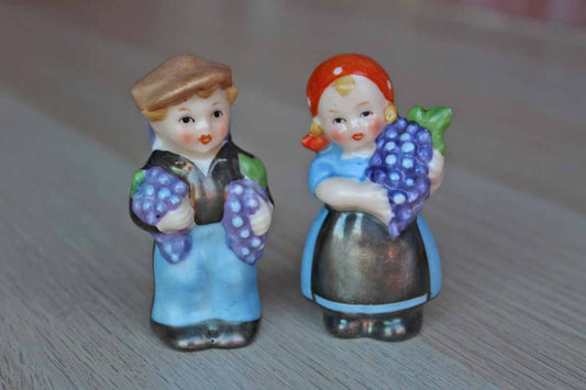 Small Porcelain Salt and Pepper Shakers Shaped Like Little Children Carrying Grape Clusters