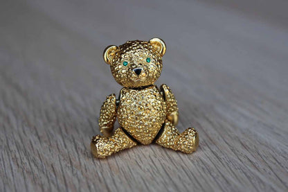Gold Tone Teddy Bear Brooch with Articulating Arms and Legs and Green Rhinestone Eyes