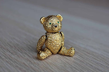 Gold Tone Teddy Bear Brooch with Articulating Arms and Legs and Green Rhinestone Eyes