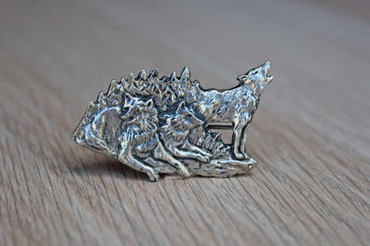Silver Metal Brooch with Etched Rendering of a Howling Wolf with His Pack