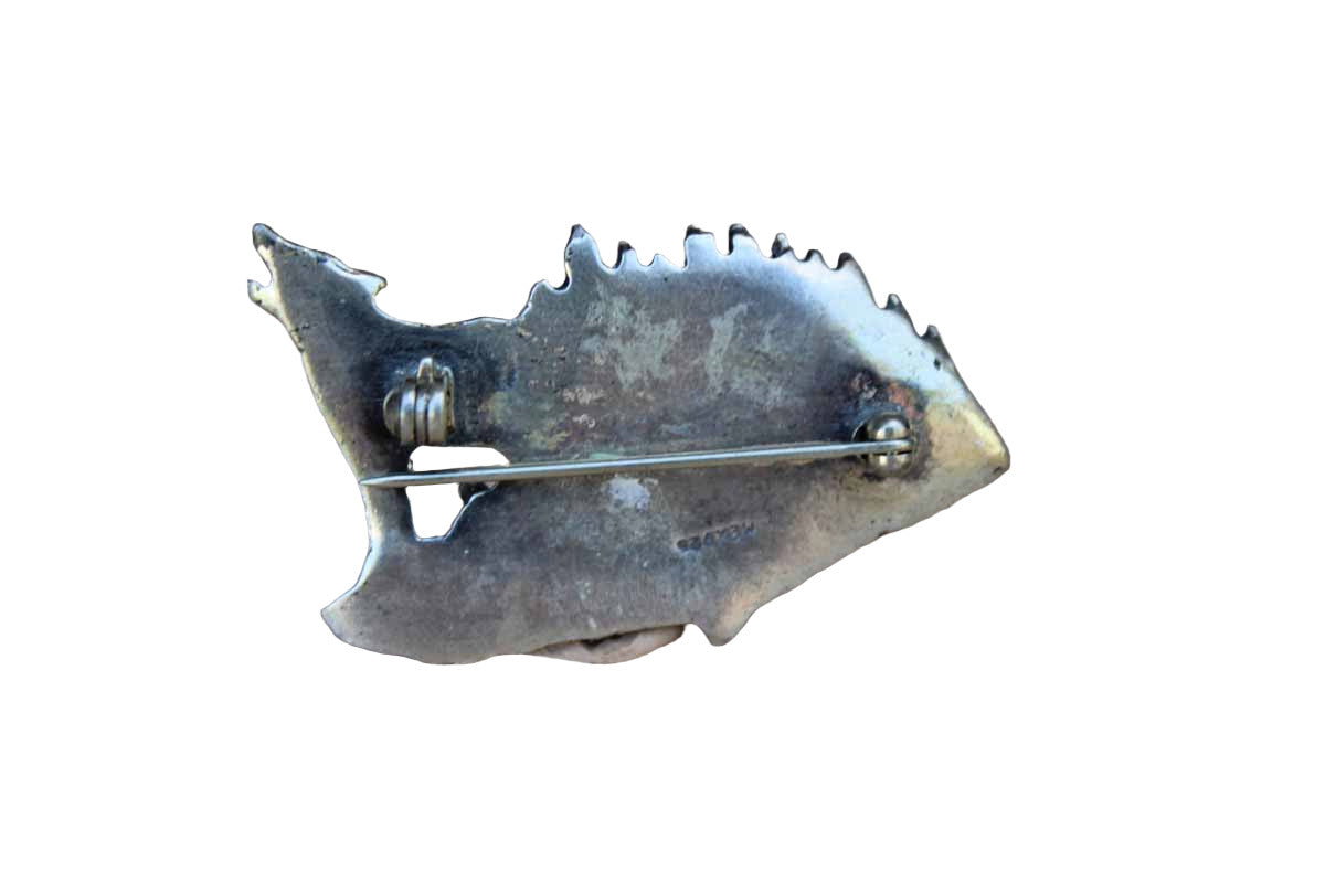 Silver Metal Brooch with Etched Rendering of a Howling Wolf with His Pack