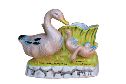 Flower Planter with Colorful Pink Ducks on a Light Green Background