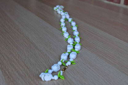 Long Single Strand Necklace Decorated with Plastic White Flowers and Green Leaves, Made in Hong Kong
