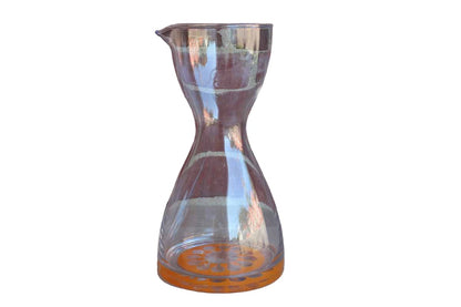 Clear Glass Juice Carafe with Graphic Orange Design on the Bottom