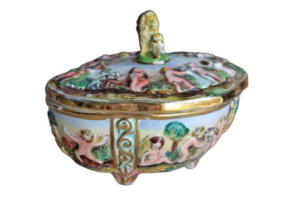 Italian Capodimonte Covered Dish with Raised Cherubs. Dogs, and Lion Finial