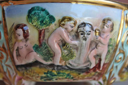 Italian Capodimonte Covered Dish with Raised Cherubs. Dogs, and Lion Finial