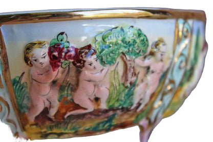 Italian Capodimonte Covered Dish with Raised Cherubs. Dogs, and Lion Finial