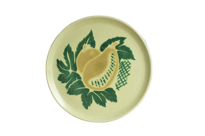 A beautiful round art pottery serving platter decorated with a large mango in the "South Pacific" pattern from Brock Ware.  The platter measures 13 5/8" across the rim, 1" high, and weighing over 3 1/2 pounds.  The bottom is marked "South Pacific Brock Ware Pat Pend."  The plate is in very good condition.