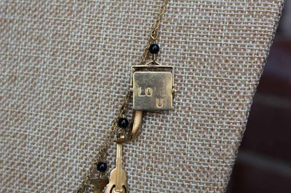 Gold Tone Necklace with Baby Charms