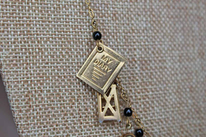 Gold Tone Necklace with Baby Charms