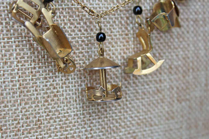 Gold Tone Necklace with Baby Charms