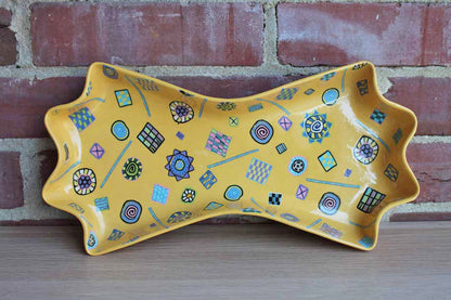 Bow Tie-Shaped Ceramic Dish with Colorful Millefiori-Style Shapes and Designs