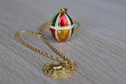Gold Tone Colorfully Enameled Egg Locket on a Gold Chain