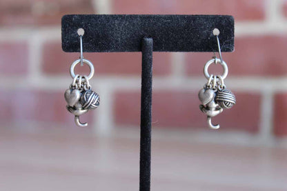 Silver Tone Pierced Earrings with Dangling Cat, Yarn, and Heart with Paw Imprint Charms