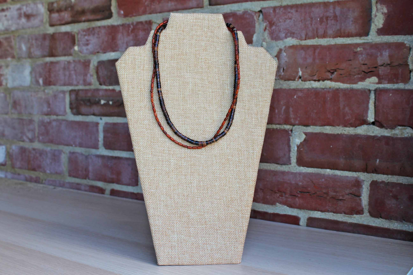 Pair of Polished Wood and Brown Stone Beaded Necklaces