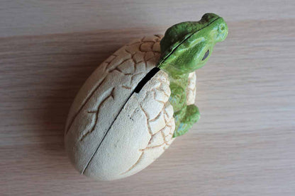 Hatching Baby Dinosaur Cast Iron Coin Bank