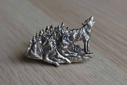 Silver Metal Brooch with Etched Rendering of a Howling Wolf with His Pack
