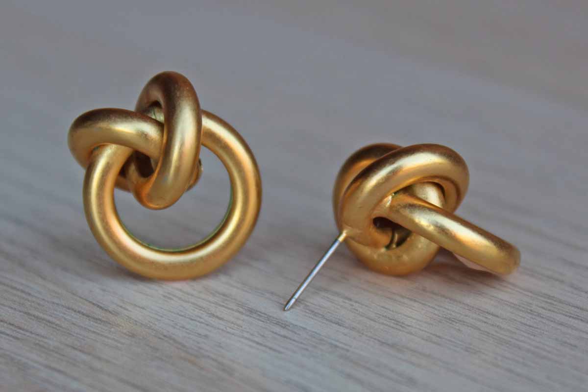 Gold Tone Pierced Earrings Shaped Like Knots