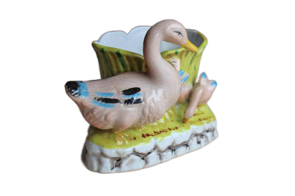 Flower Planter with Colorful Pink Ducks on a Light Green Background