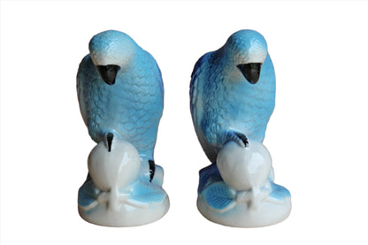 Ceramic Blue Parrots Clutching Flowering Fruit, A Pair