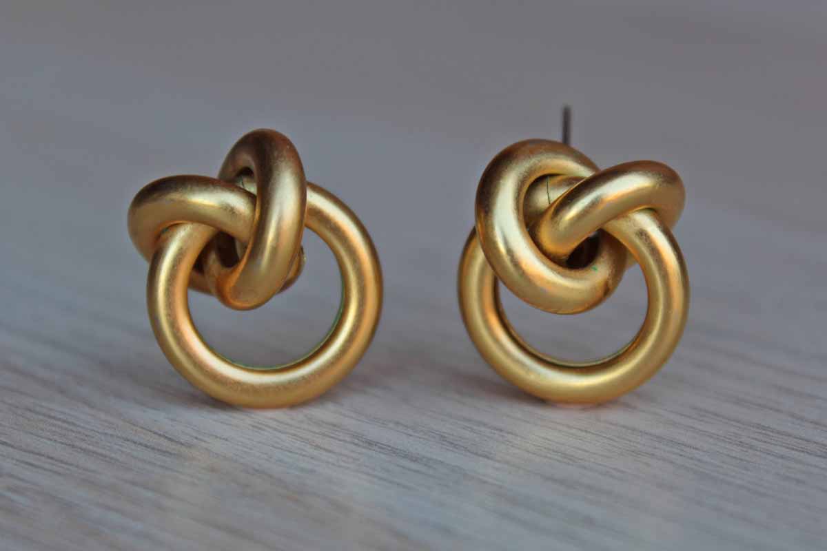 Gold Tone Pierced Earrings Shaped Like Knots
