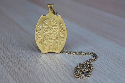 Brass Pendant Necklace with Two-Sided Abstract Design of Two People Standing Amidst Trees