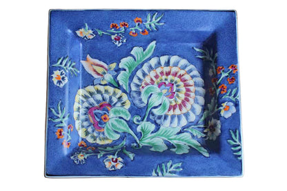 Heavy Rimmed Stoneware Dish with Colorful Flowers on Blue Background