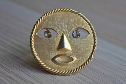 Jeanne (New York) Gold Tone Modern Sun Brooch with Dangling Silver Rhinestone Eyes