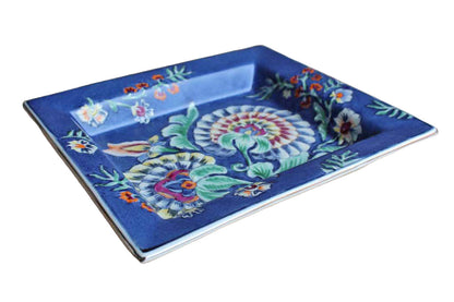 Heavy Rimmed Stoneware Dish with Colorful Flowers on Blue Background