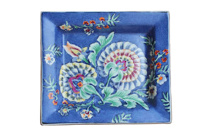 Heavy Rimmed Stoneware Dish with Colorful Flowers on Blue Background
