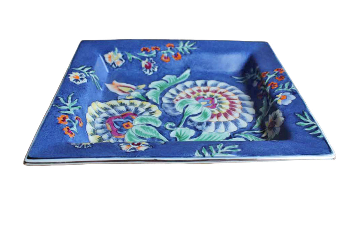 Heavy Rimmed Stoneware Dish with Colorful Flowers on Blue Background
