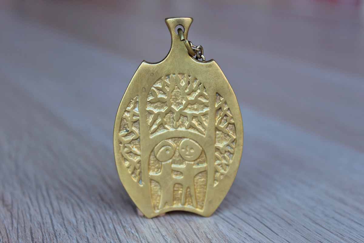 Brass Pendant Necklace with Two-Sided Abstract Design of Two People Standing Amidst Trees