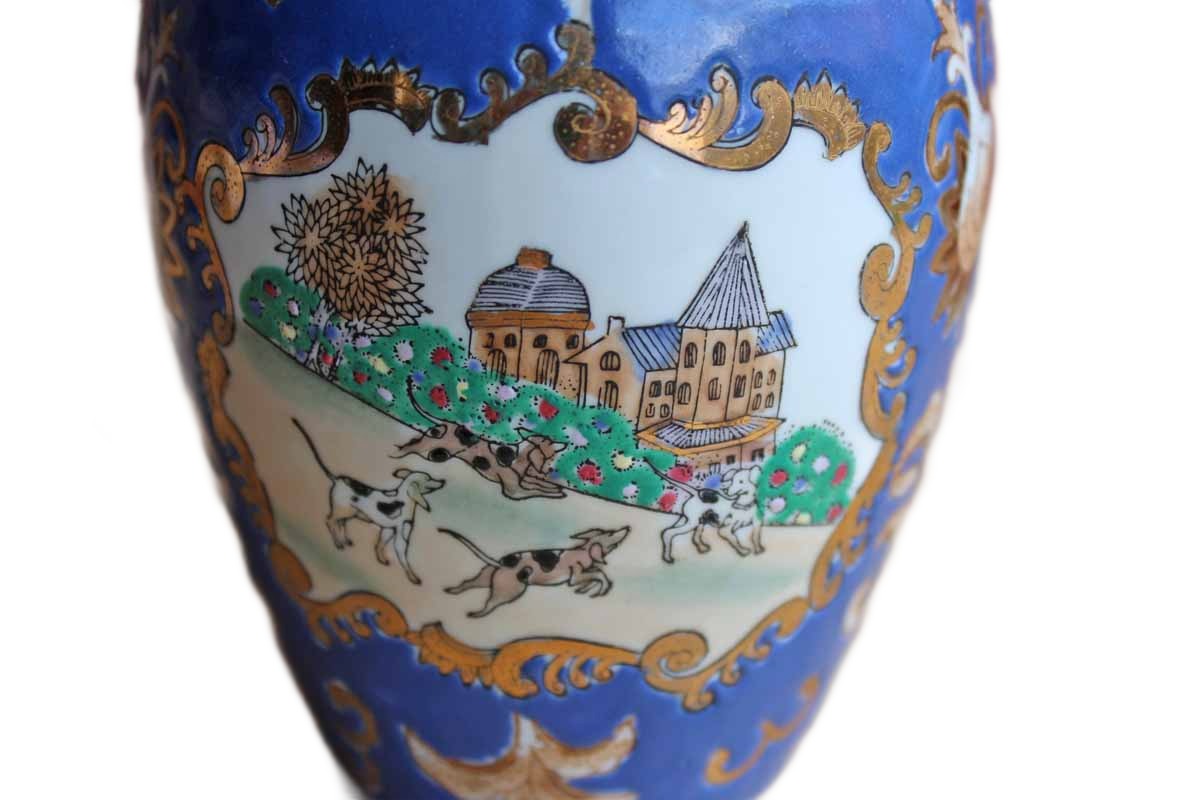 Porcelain Vase Decorated with Cameos of Dogs Playing in a Village Surrounded by Gilded Flowers