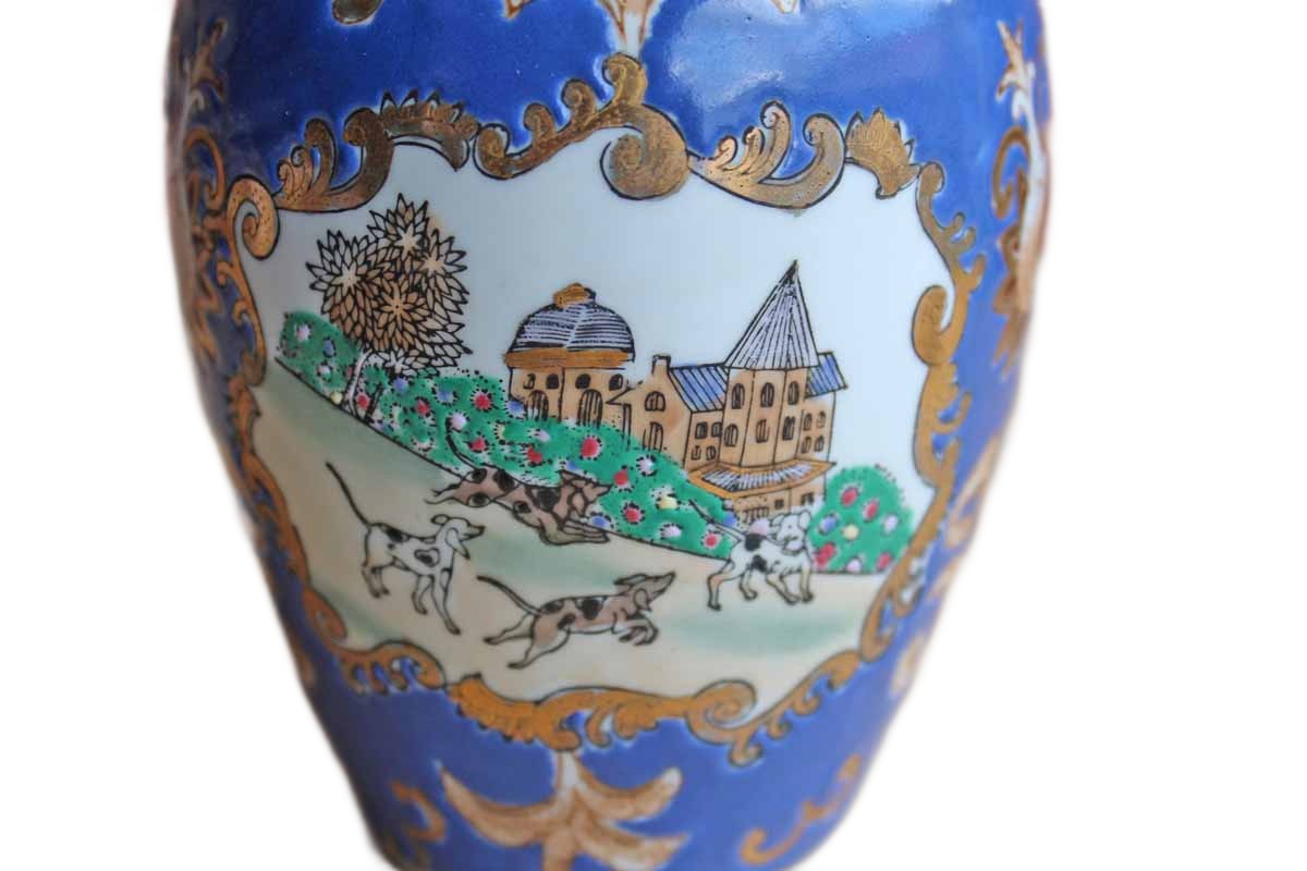 Porcelain Vase Decorated with Cameos of Dogs Playing in a Village Surrounded by Gilded Flowers