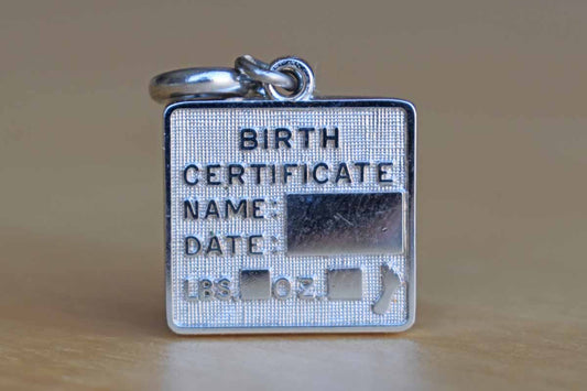 Monet (New York, USA) Silver Tone Metal Birth Certificate Charm