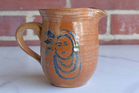 Small Stoneware Handled Pitcher with Blue Woman on Front