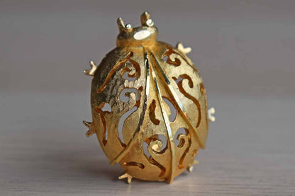 Gold Tone Metal Ladybug Brooch with Filigree Designs
