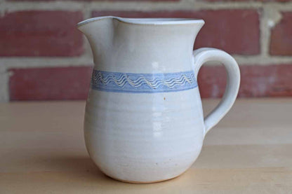 Little Stoneware Handled Pitcher with Wavy Blue Band